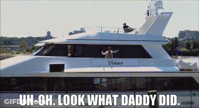 A Man Is Standing On The Deck Of A White Yacht With The Words Uh-Oh Look What Daddy Did GIF