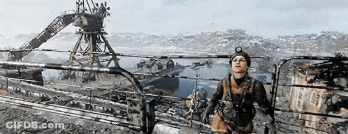A Man Is Standing On Top Of A Fence Overlooking A Body Of Water In A Video Game . GIF