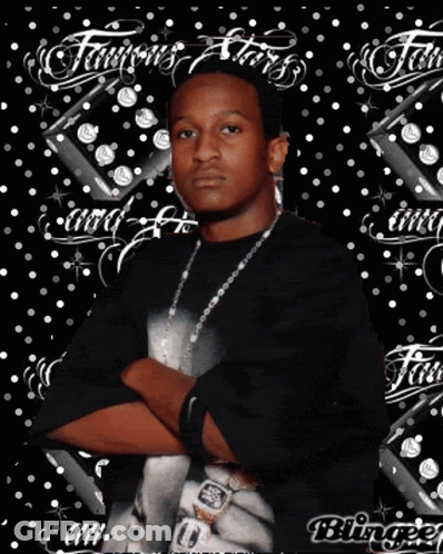 A Man Is Standing With His Arms Crossed In Front Of A Background That Says Famous Stars GIF