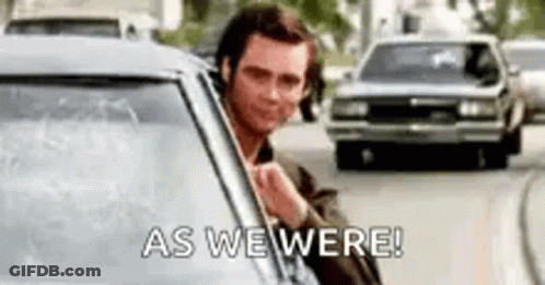 A Man Is Sticking His Head Out Of A Car Window And Saying `` As We Were '' . GIF