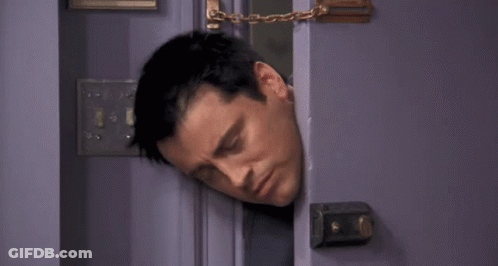A Man Is Sticking His Head Out Of A Door With The Words I 'M Stuck Below Him . GIF