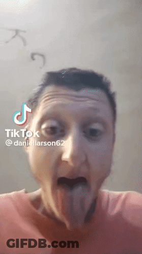 A Man Is Sticking His Tongue Out In A Tik Tok Video Taken By Daniellarson62 GIF