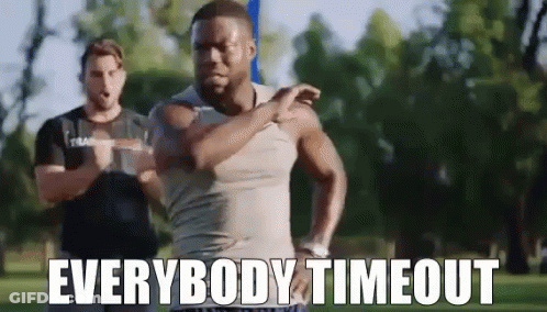 A Man Is Stretching His Arms In A Park With The Words `` Everybody Timeout '' . GIF