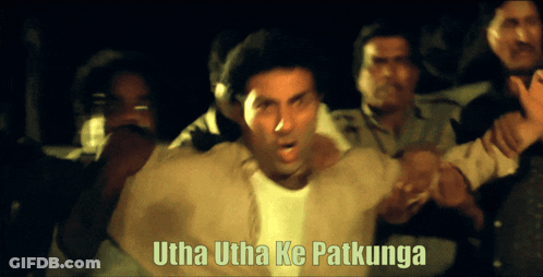 A Man Is Surrounded By People With The Words Utha Utha Ke Patkunga Written Above Him GIF