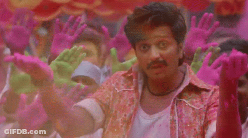 A Man Is Surrounded By Pink And Green Hands GIF