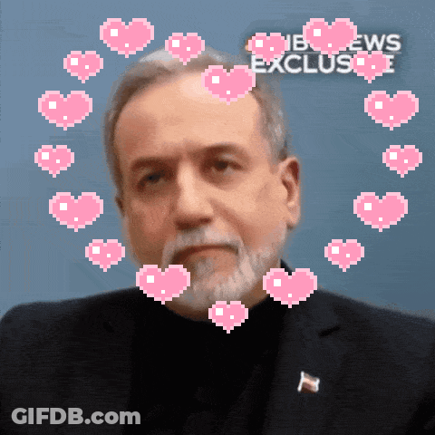 A Man Is Surrounded By Pink Hearts And The Words Nbc News Exclusive Are Behind Him GIF