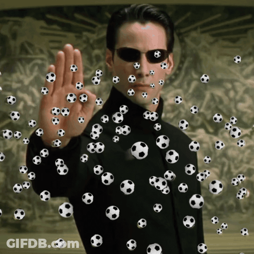 A Man Is Surrounded By Soccer Balls And Making An Ok Sign GIF