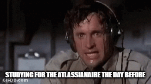 A Man Is Sweating While Wearing Headphones And Looking At The Camera . GIF