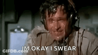 A Man Is Sweating While Wearing Headphones And Says `` Im Okay I Swear '' . GIF
