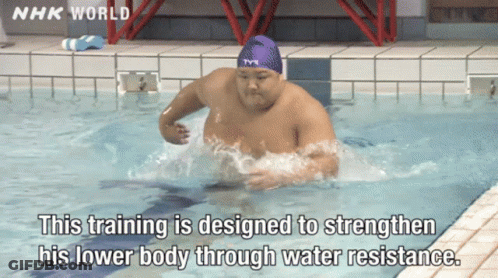 A Man Is Swimming In A Pool With Nhk World Written On The Bottom GIF