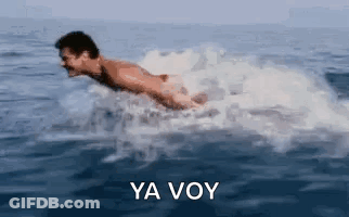 A Man Is Swimming In The Ocean With The Words Ya Voy In The Corner . GIF