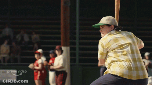 A Man Is Swinging A Baseball Bat In Front Of A Sign That Says " Prime Video " GIF