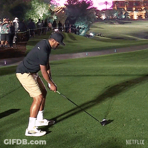 A Man Is Swinging A Golf Club On A Golf Course With Netflix Written On The Bottom GIF