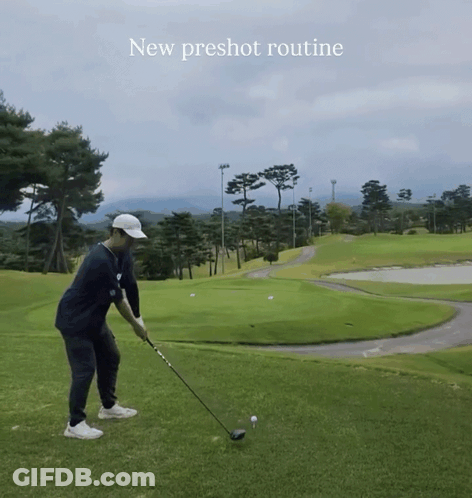 A Man Is Swinging A Golf Club On A Golf Course With The Words " New Preshot Routine " Above Him GIF