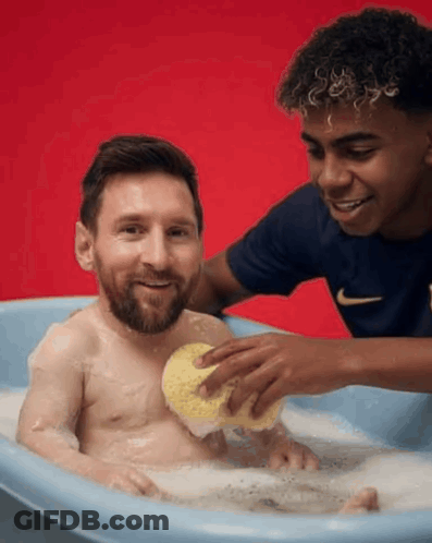 A Man Is Taking A Bath With A Sponge While Another Man Watches GIF