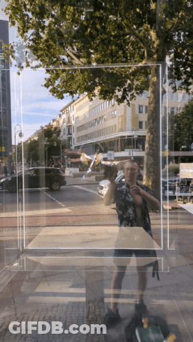 Man Taking Selfie In Front Of Building 'A GIF