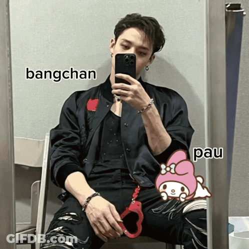 A Man Is Taking A Picture Of Himself In Front Of A Mirror With Bangchan And Pau Written On The Bottom GIF