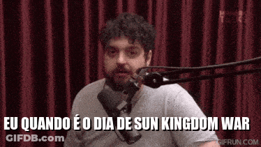 A Man Is Talking Into A Microphone With The Words Eu Quando E O Dia De Sun Kingdom War Written Below Him GIF