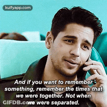 A Man Is Talking On A Cell Phone And Has A Quote On It . GIF