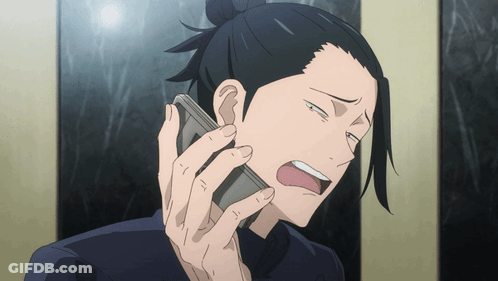 A Man Is Talking On A Cell Phone And Making A Funny Face GIF