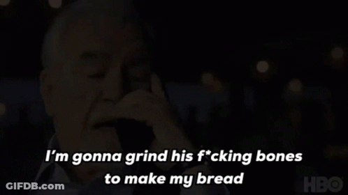 A Man Is Talking On A Cell Phone And Saying I 'M Gonna Grind His Fucking Bones To Make My Bread GIF