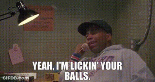 A Man Is Talking On A Cell Phone And Saying `` Yeah , I 'M Licking Your Balls '' GIF