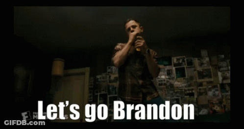 A Man Is Talking On A Cell Phone And The Words Let 'S Go Brandon Are On The Screen . GIF