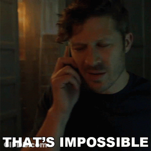 A Man Is Talking On A Cell Phone And The Words That 'S Impossible Are Above Him GIF