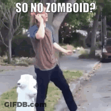 A Man Is Talking On A Cell Phone Next To A Fire Hydrant . GIF
