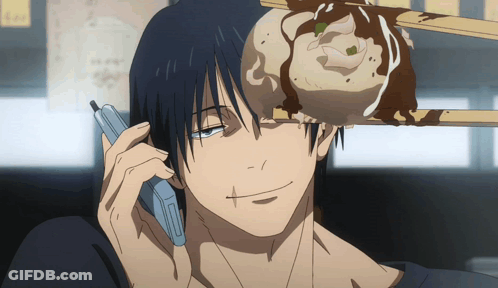 A Man Is Talking On A Cell Phone While A Dumpling Is On His Head GIF