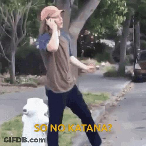 A Man Is Talking On A Cell Phone While Standing Next To A White Fire Hydrant . GIF