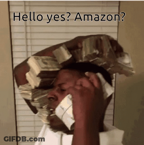 A Man Is Talking On A Cell Phone With A Stack Of Money On His Head GIF