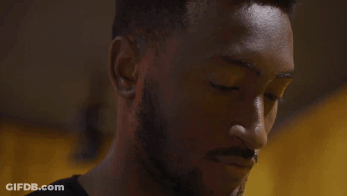 A Man Is Talking On A Cell Phone With The Word Hello Written Below Him GIF
