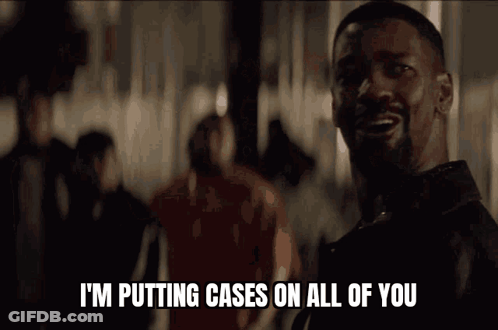 A Man Is Talking On A Phone And Says " I 'M Putting Cases On All Of You " GIF