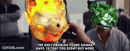 A Man Is Talking On A Phone Next To A Burning Skull And A Green Monster . GIF