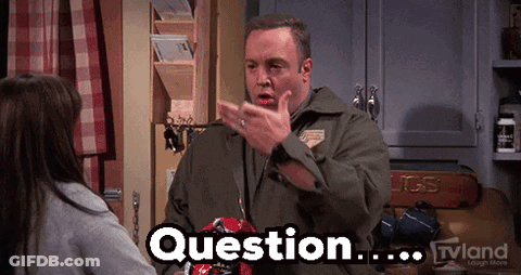 A Man Is Talking To A Girl In A Kitchen And The Word Question Is On His Chest GIF