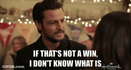 A Man Is Talking To A Woman With The Words If That 'S Not A Win I Don 'T Know What Is GIF