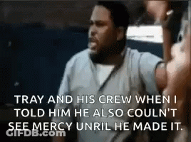 A Man Is Talking To Another Man In A Prison Cell While Holding A Microphone . GIF