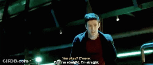 A Man Is Talking To Another Man In A Room With A Large Window . GIF