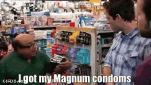 A Man Is Talking To Another Man In A Store About Condoms . GIF