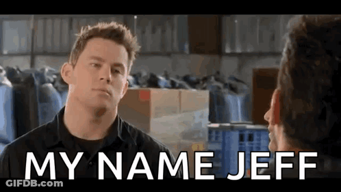 A Man Is Talking To Another Man In A Warehouse With The Words `` My Name Jeff '' Above Him . GIF