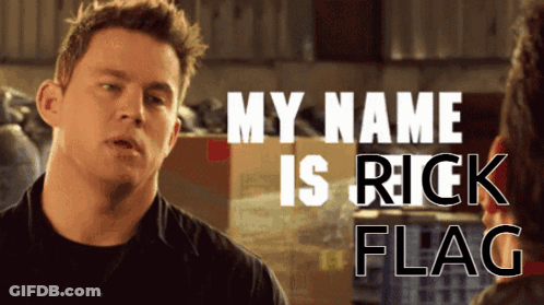 A Man Is Talking To Another Man With The Words My Name Is Rick Flag Behind Him GIF