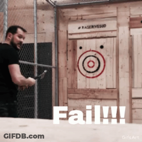 A Man Is Throwing An Axe In Front Of A Target That Says Fail GIF