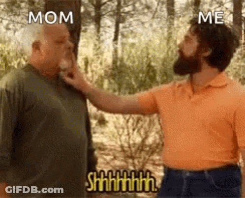 A Man Is Touching Another Man 'S Face In The Woods . GIF