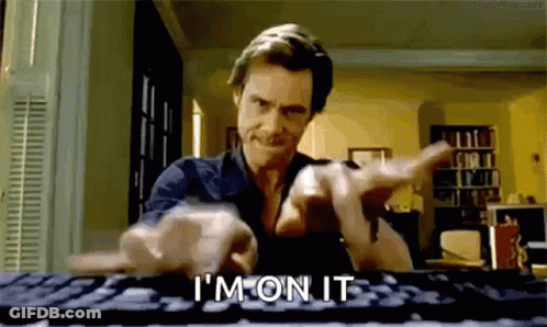 A Man Is Typing On A Computer Keyboard And Pointing At The Camera While Saying `` I 'M On It '' . GIF