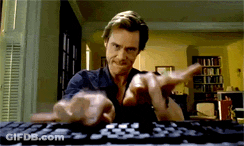 A Man Is Typing On A Keyboard While Making A Funny Face GIF