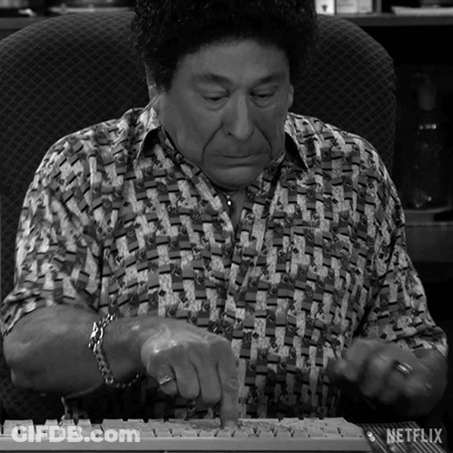 A Man Is Typing On A Keyboard With Netflix Written On The Bottom Right GIF