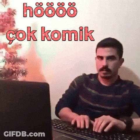 A Man Is Typing On A Keyboard With The Words Hoööö Çok Komik Written Above Him GIF
