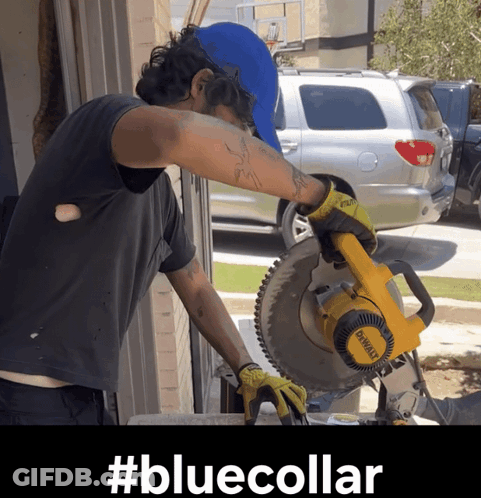 A Man Is Using A Dewalt Circular Saw GIF