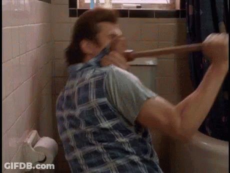 A Man Is Using A Plunger In A Bathroom . GIF